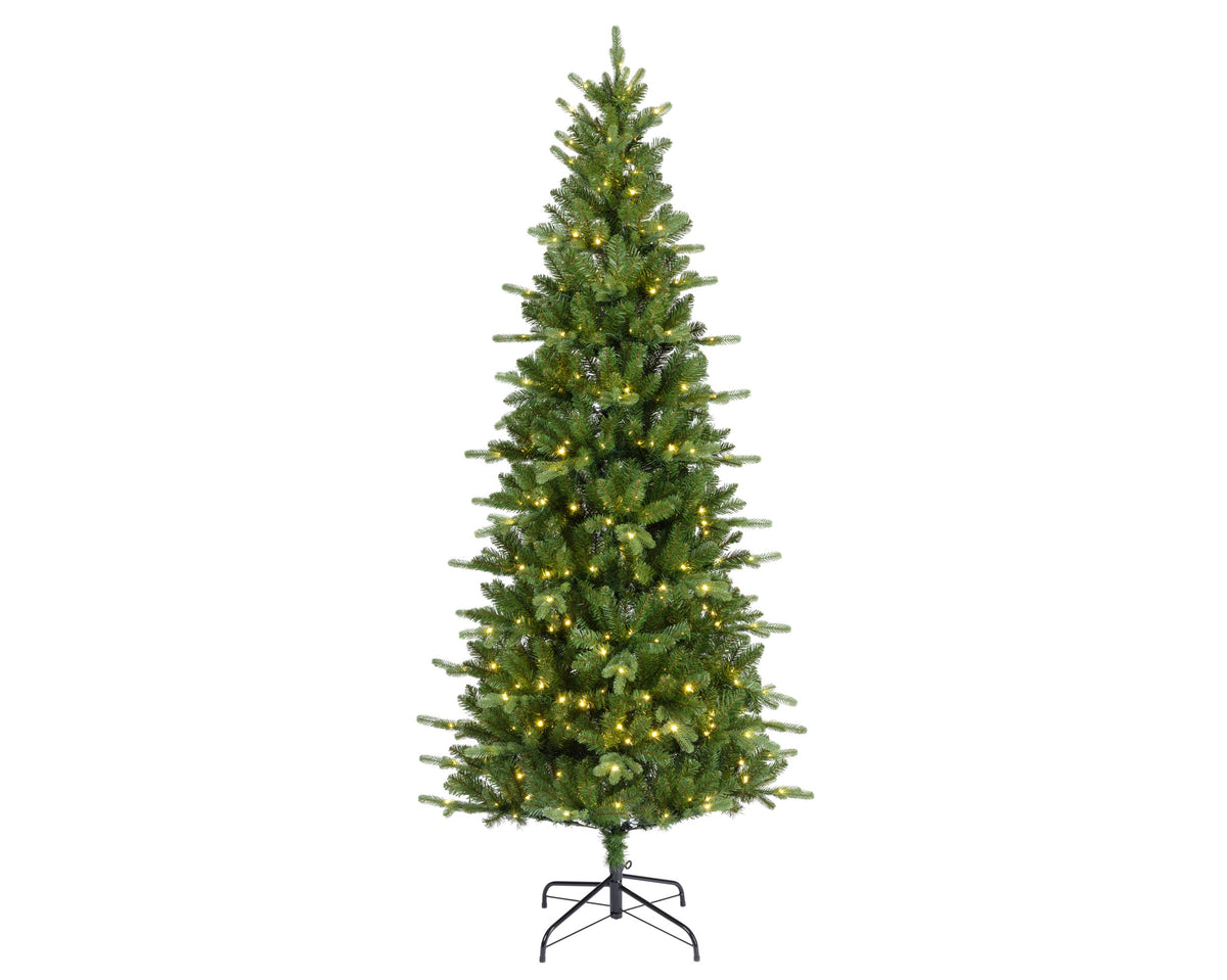 A pre-lit artificial Christmas tree with green needles and warm yellow lights, standing on a black metal star base against a plain white background.